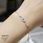 انسيال ذهب عيار 18 مرصعة بفص أزرق وزركون - تصميم ملكي راقٍ