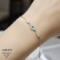 انسيال ذهب عيار 18 مرصعة بفص أزرق وزركون - تصميم ملكي راقٍ